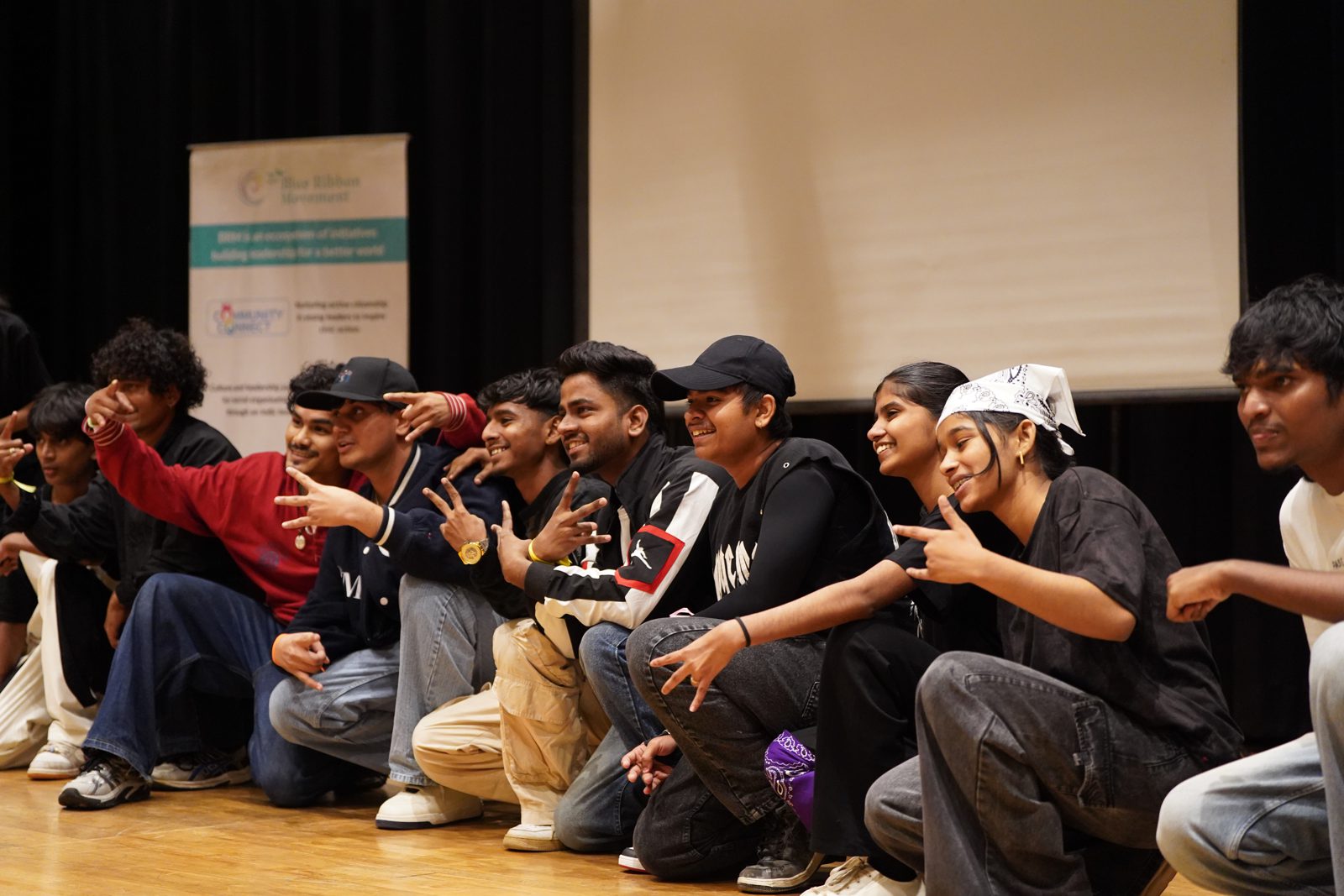 The Dharavi Dream Project crew receiving the WISE Locality Award on stage