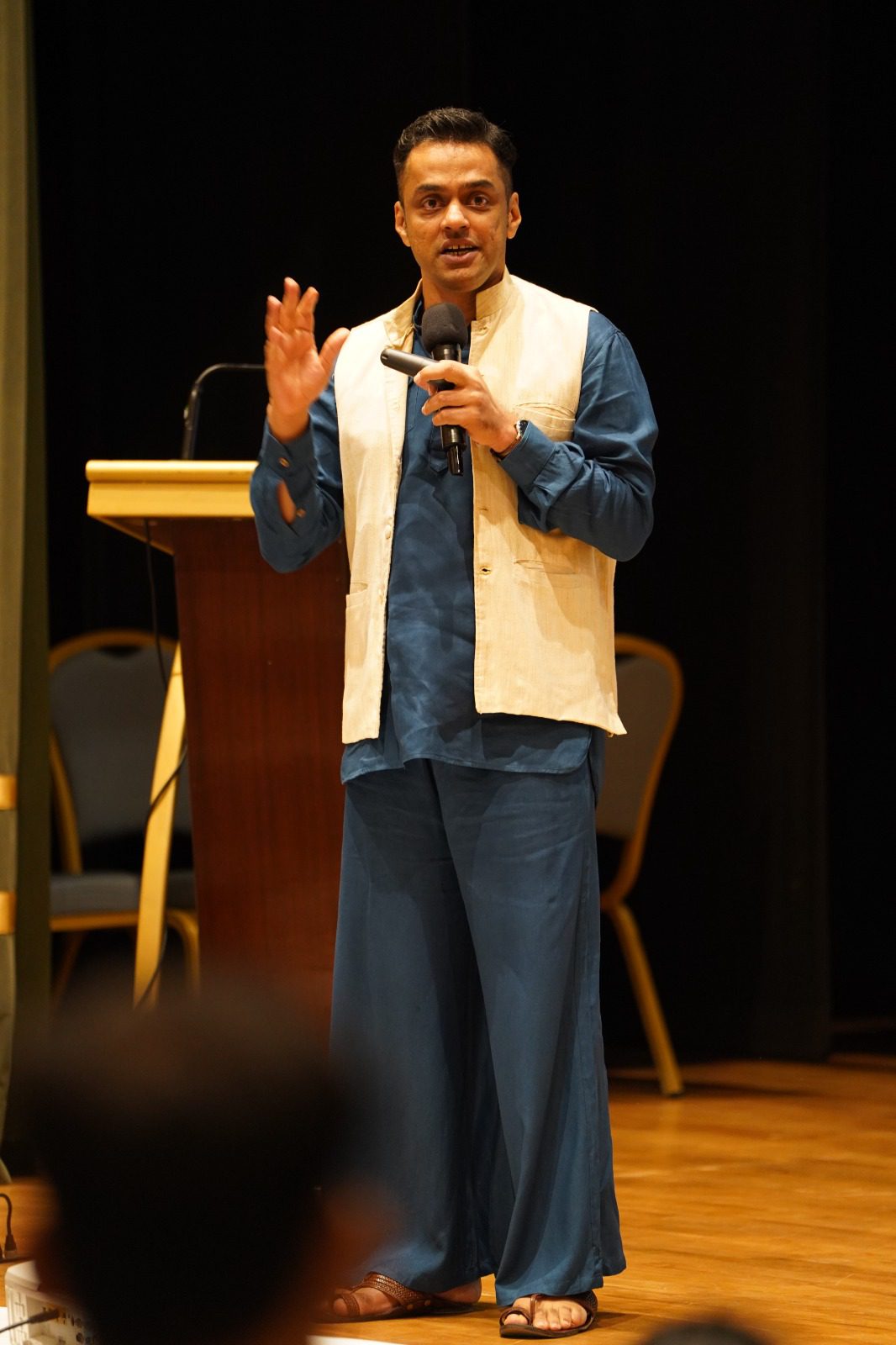 A speaker addressing the room