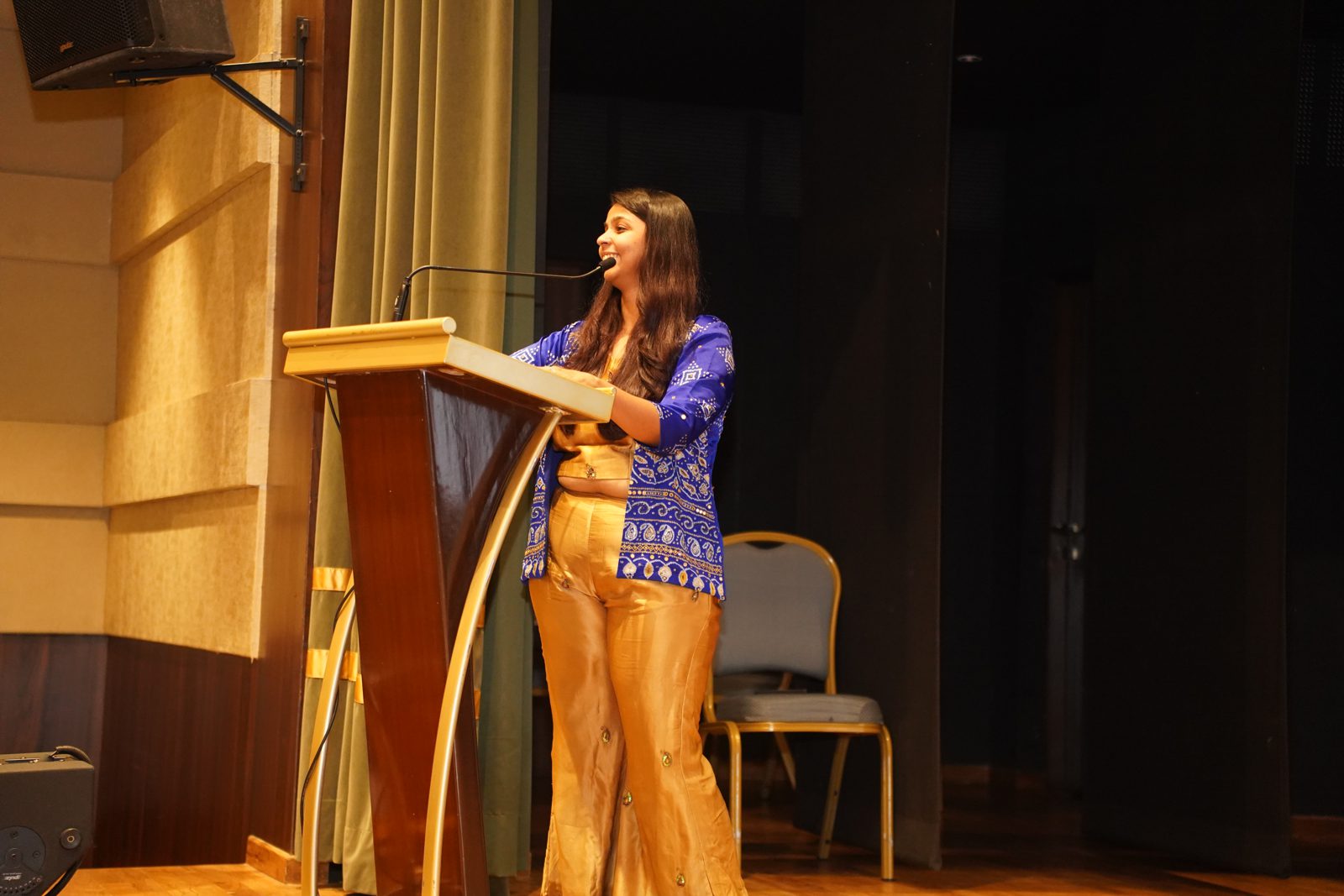 A speaker at the podium during the Summit